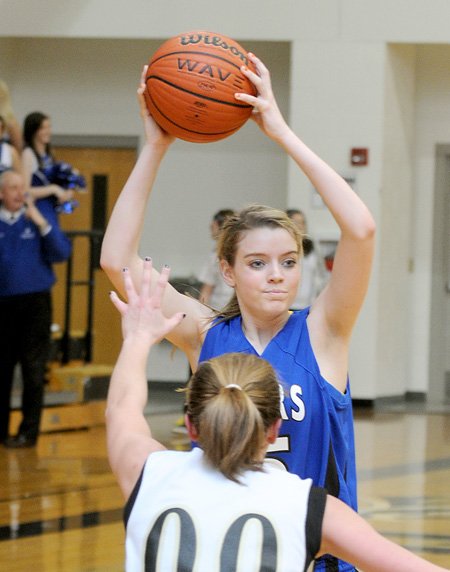 PREP BASKETBALL - Rogers High’s Sarah Groves looks for room to pass against Bentonville on Feb. 2 at Bentonville.