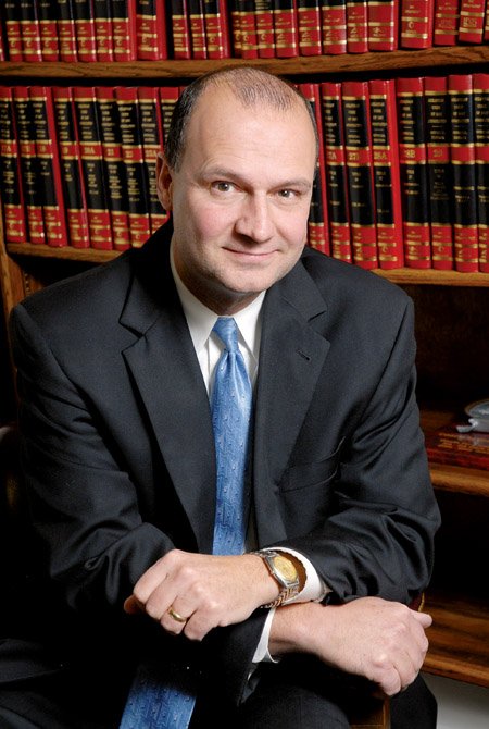 Sandy Huckabee serves as circuit judge for the 23rd Judicial Circuit, Division 3. His friends and co-workers describe him as kind and caring with a great sense of humor, despite his difficult career.