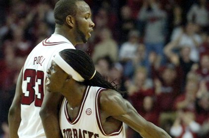 Arkansas' Courtney Fortson (4) celebrates with teammate Marshawn Powell (33) after Arkansas took the lead in overtime against Auburn in an NCAA college basketball game in Fayetteville on Saturday.