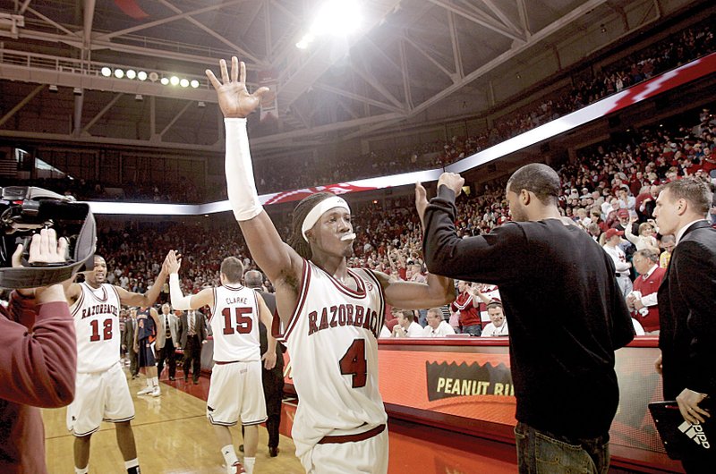 Arkansas sophomore Courtney Fortson celebrates with teammates following the Razorbacks' 82-79 overtime win over Auburn Saturday at Bud Walton Arena in Fayetteville.