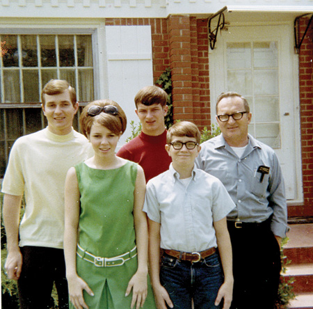 Unclaimed Family Photo - George, Dennis, Ann, Robert and John posed for a photograph that is one of many in a photograph album found on the roadside.