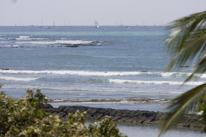 The ocean at Waikiki Beach starts to recede Saturday in Honolulu. A tsunami triggered by an earthquake in Chile swept ashore in Hawaii on Saturday, but the initial waves did not appear to cause significant damage.