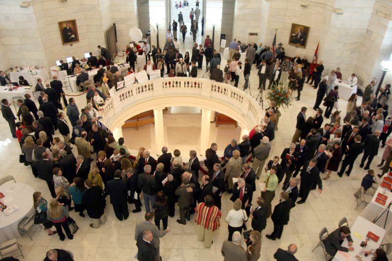 Candidates for state and federal offices line up in the Capitol rotunda in Little Rock to file for office Monday, opening day of the filing period.