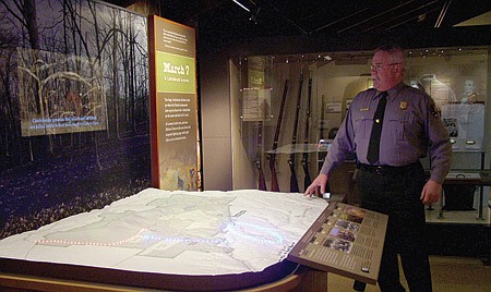 BATTLE OF PEA RIDGE IN LIGHTS - Blue and red lights show troop movements on the new interactive display at Pea Ridge National Military Park as a video plays depicting battle scenes. John Scott, superintendent, said the new displays are designed to educate visitors about the events of the Battle of Pea Ridge which occurred March 7-8, 1862.
