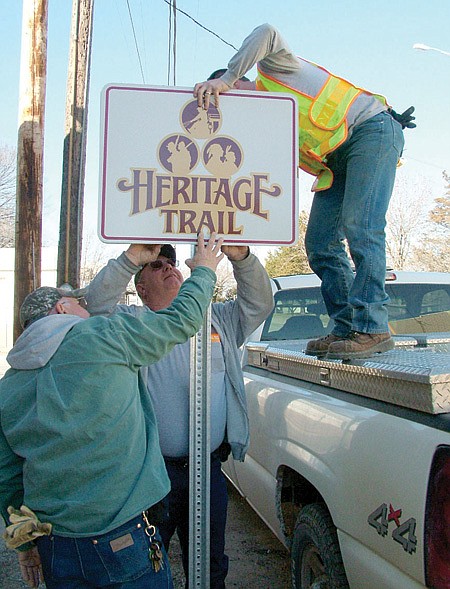 Identifying the rich historical heritage of the trails of the Pea Ridge area, Heritage Trail signs were erected recently by Pea Ridge Street Department employees Larry Majors, Nathan See and Tommy Thompson.