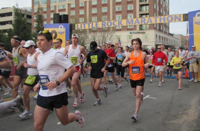 Runners take off as the Little Rock Marathon begins.