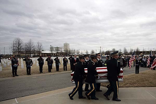  Arkansas Democrat-Gazette/WILLIAM MOORE
A military Honor Guard carries the casket of Sgt. Vincent Owens of Fort Smith during his funeral Friday, March 12, 2010 at Fort Smith National Cemetary in Fort Smith.  Owens, 21, was killed while serving with the 101st Airborne Division (Air Assault) in eastern Afghanistan.