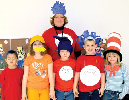 Students and their teacher show off their costumes during the recent Dr. Seuss celebration.