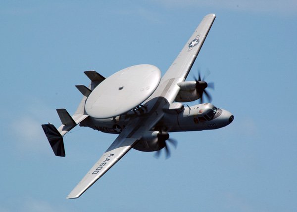 An E-2C Hawkeye assigned to the "Bluetails" Carrier Airbourne Early Warning Squadron One Two One (VAW-121) executes a high performance fly-by during an Air Power Demonstration .