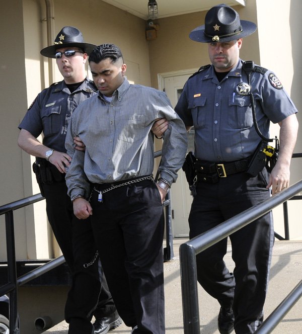 Erickson Dimas-Martinez is escorted Thursday from the Benton County Courthouse Annex in Bentonville by a pair of Benton County Sheriff’s Office deputies after a jury recommended he be sentenced to death for the capital murder of Derrick Jefferson in 2006.
