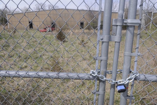The R&P Electroplating building stands behind a chained gate Thursday at 2000 Pump Station Road in Fayetteville. The company operated at the site from 1977 to 1997. Contaminates at the facility include heavy metal, vinyl chloride and other solvents.