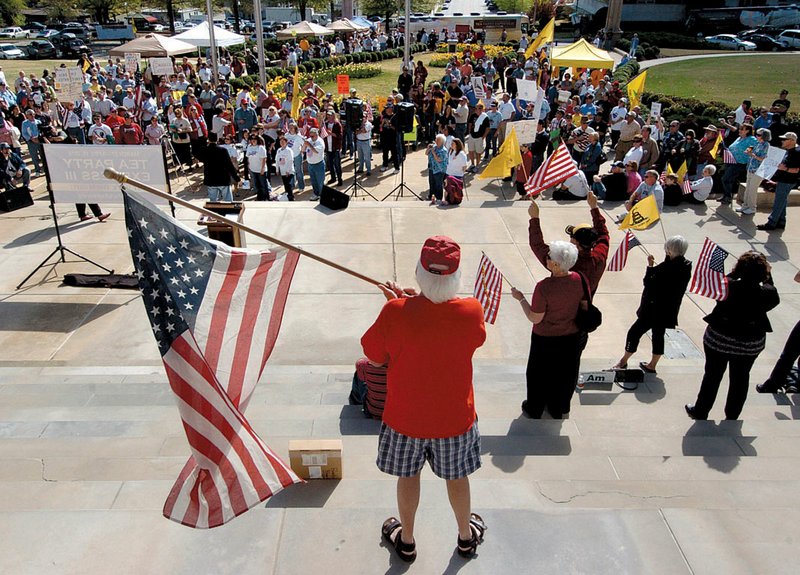 Some Arkansas join a Tea Party Express rally Saturday outside the state Capitol in Little Rock. 