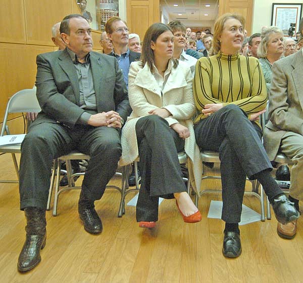 Former Arkansas Governor Mike Huckabee, left with daughter Sarah Huckabee, and wife, Janet,  Monday at the Clinton School of Public Service.