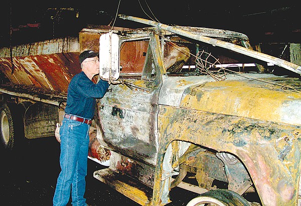 Benton County Fire Marshal Will Hanna pointed out the origin of a fire inside the cab of a feeder truck inside a chicken house on the Harvey Keene farm on Commonwealth Road. Hanna said the fire on Friday, April 2, was caused by arson. Firefighters were called to the scene again about 1 a.m. Monday, April 5, for another fire.
