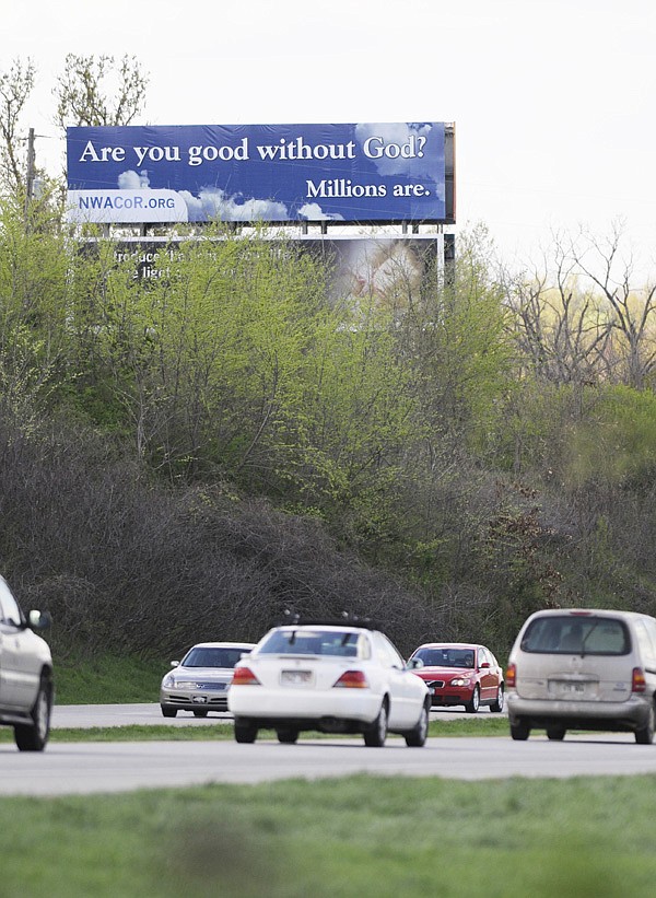 A billboard reading “Are you good without God? Millions are.” is visible from Interstate 540 in Springdale on Wednesday.