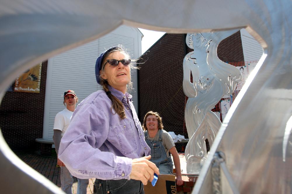 3222010Arkansas Democrat-GazetteSTEPHEN B. THORNTONArtist Alice Guffey Miller, center, talks with Mark Englerth, left, and Jeffrey Trotter as they help her install portions of her sculpture titled "pARTy for PEG" Monday afternoon at the Historic Arkansas Museum.