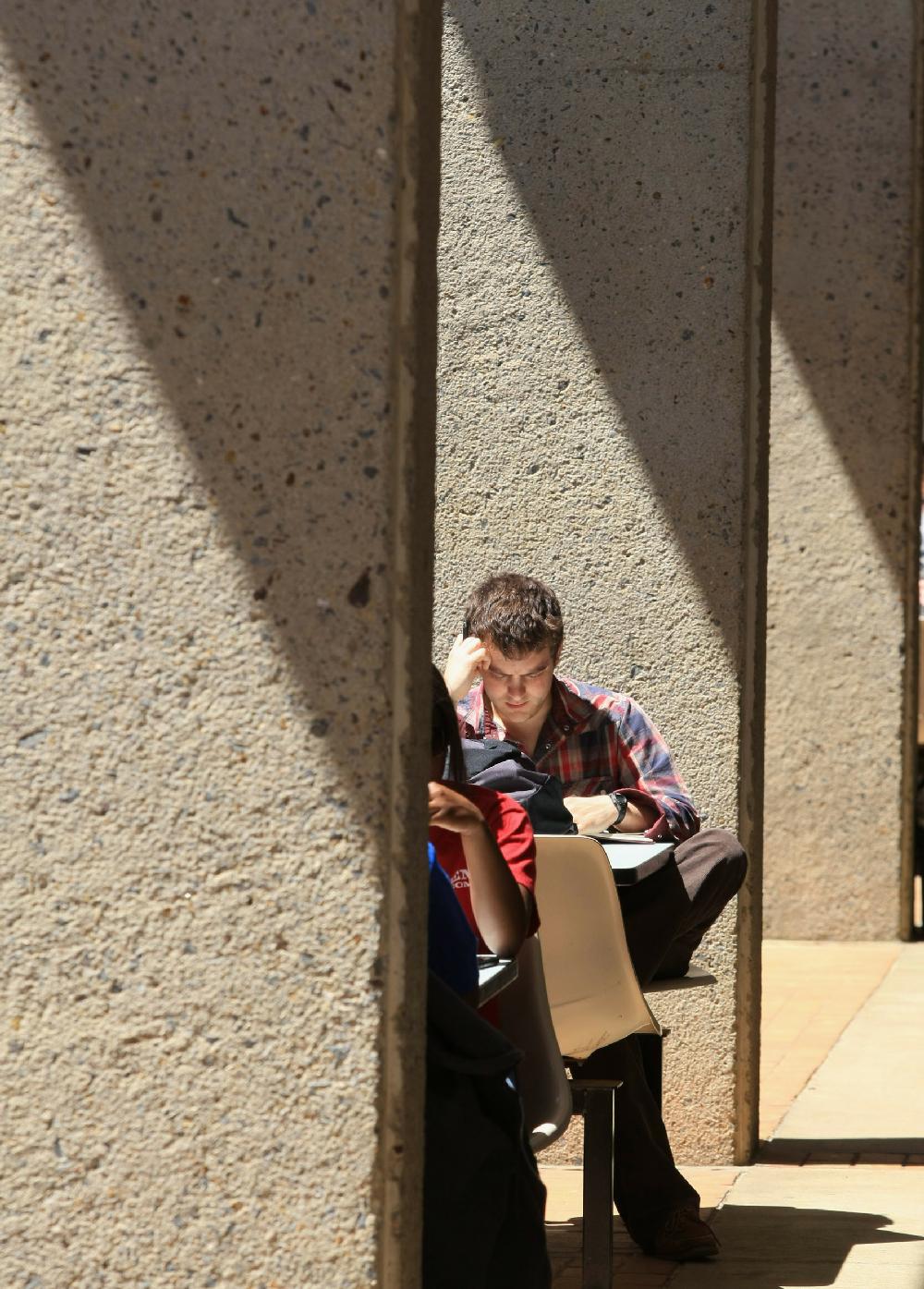 Arkansas Democrat-Gazette STATON BREIDENTHAL --41210-- North Little Rock junior Bart Carfagno(cq) studies between classes Monday afternoon at the University of Arkansas Little Rock campus.