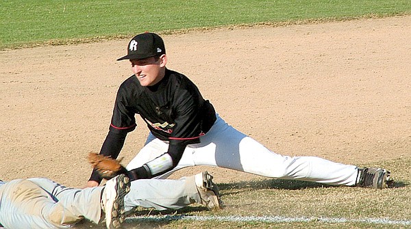 Brandon Easterling, senior Blackhawk, tagged a Prairie Grove baserunner at third base in a home game Monday evening.