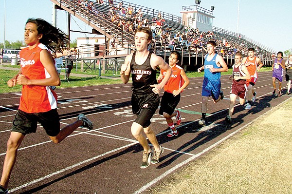 Colton Holtgrewe crosses the finish line in the Gentry track meet last week. Holtgrewe placed twice — eighth in the 1600 and sixth in the 3200.