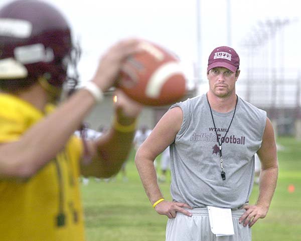   Former NFL quarterback Ryan Leaf, the new quarterbacks coach at West Texas A&M University, works with the offense during football practice Wednesday, Aug. 15, 2006, in Amarillo, Texas.  