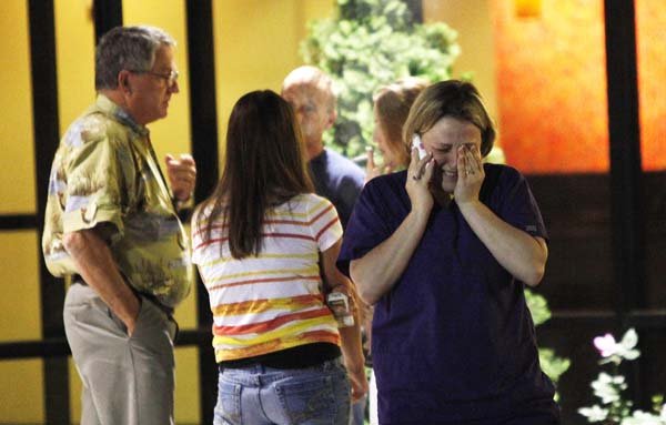 Christy Murray, sister of rescued oil rig worker Chad Murray, waits with her father and relatives of a missing crew member Thursday at a hotel in Kenner, La.