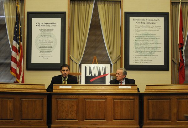 Greg Leding, left, and Bill Ramsey, candidates for the House of Representatives race in District 92, speak Friday during a forum hosted by the League of Women Voters of Washington County at the Fayetteville Administration Building.