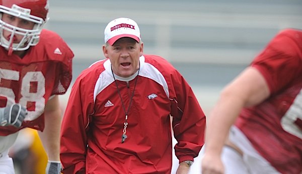 Arkansas Coach Bobby Petrino yells instructions to his players during practice April 21 in Fayetteville.