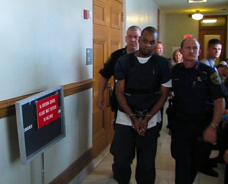 Abdulhakim Muhammad is led from the courtroom after a hearing on April 27.