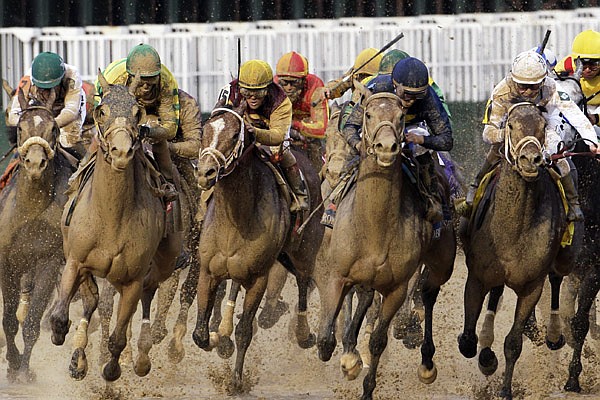  Calvin Borel (front, along rail) rides Super Saver to victory during the Kentucky Derby on Saturday at Churchill Downs in Louisville, Ky.