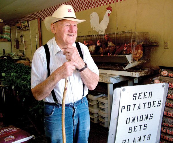 Fred McKinney delights in stories of the past as he stands among the feed sold at Webb’s Feed and Seed, where he’s been working for the past seven decades. McKinney will be honored with a reception from 1 to 4 p.m. Friday, May 7, at the store. See the story on page 8A of today’s TIMES.
Fred McKinney at work for 70 years