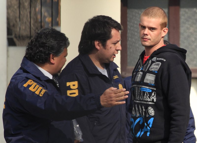 Chile's investigative police detain Dutch citizen Joran van der Sloot, after he was located in a neighborhood in Santiago, Thursday, June 3, 2010. 