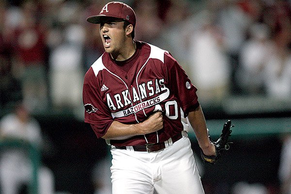  Arkansas relief pitcher Jordan Pratt celebrates after working out of an eighth-inning jam Saturday night in the Razorbacks’ 6-4 victory over Washington State at Baum Stadium in Fayetteville. Pratt came in with a 5-4 lead and the bases loaded and retired three consecutive batters to end the threat.