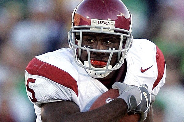 Former Southern California running back Reggie Bush, who won the 2005 Heisman Trophy, was declared ineligible dating back to the Trojans’ 2004 national championship season after the NCAA leveled Southern California with stinging penalties Thursday, issuing a two-year bowl ban.