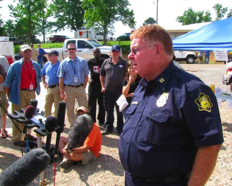 Arkansas State Police Capt. Mike Fletcher briefs the media at a 4 p.m. news conference on the search for flood victims.