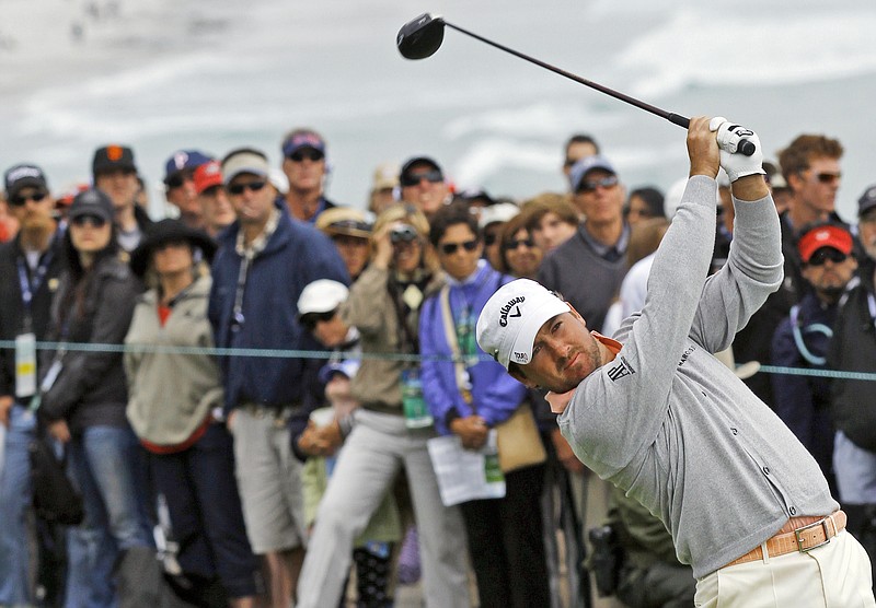 Graeme McDowell of Northern Ireland hits a drive on the 14th hole during the fourth round of the U.S. Open golf tournament Sunday, June 20, 2010, at the Pebble Beach Golf Links in Pebble Beach, Calif. 