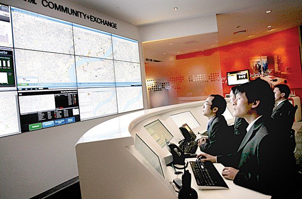 Cisco engineers demonstrate the company’s “integration operation center,” designed for new cities where networking technology is embedded into all buildings from the ground up, at the Shanghai World Expo 2010 in Shanghai on April 27.