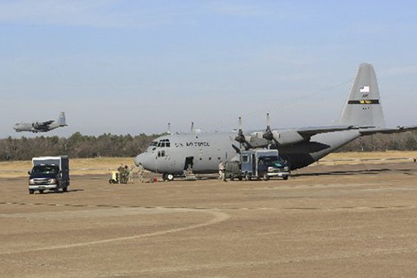 A C-130E nicknamed "Patches" sits on the flight line at Little Rock Air Force Base before being flown to the boneyard. The plane, built in 1962, has seen heavy combat in Vietnam, Grenada, the Gulf War and Iraq.