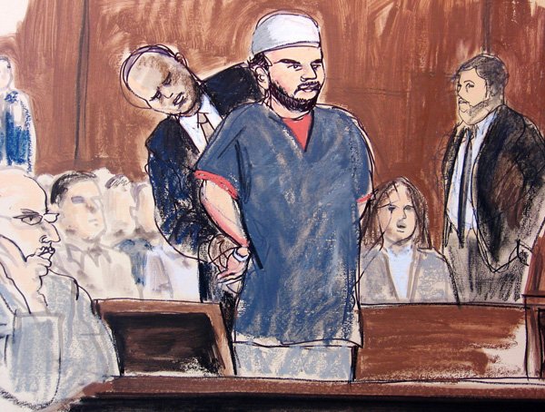 In this courtroom sketch, a U.S. Marshall removes Faisal Shahzad's handcuffs in the courtroom on Monday in New York. Shahzad pleaded guilty Monday to a charge accusing him of plotting the failed Times Square car bombing.
