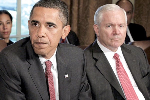President Barack Obama, joined by Secretary of Defense Robert Gates at right, tells reporters during a Cabinet meeting that he thinks Gen. Stanley A. McChrystal, the commander of Western forces in Afghanistan, used "poor judgement" in speaking candidly during an interview with Rolling Stone magazine, in the Cabinet Room at the White House in Washington, Tuesday.