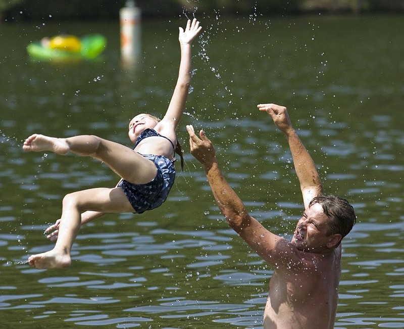 Arkansas Democrat-GazetteKAREN E. SEGRAVE62210Stephen Grigsby tosses his five-year-old daughter Anna, both from Hot Springs, up in the air and into Lake Catherine while spending the day at the swimming facility at Lake Catherine State Park on Tuesday afternoon.  The two, along with Adian Grigsby (not pictured) spent the day at Lake Catherine.