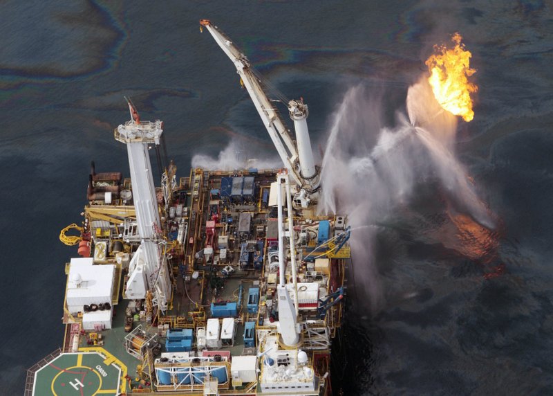  In this June 16 file photo, the Q4000 drilling rig operates in the Gulf of Mexico at the site of the Deepwater Horizon disaster. 