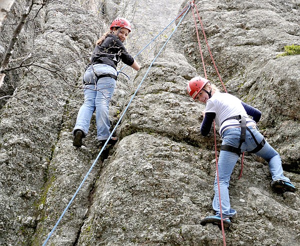 Pea Ridge High School AP Biology students climbed rocks at Sylvan Lake, where the movie National Treasure 2 was filmed. They are climbing on the rock they used for the back of the “Mt. Rushmore” rock with the lake.