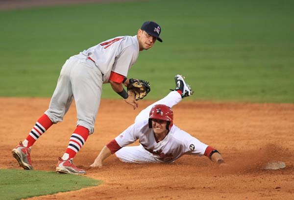 Springfield second baseman Jose Garcia and Arkansas runner Clay Fuller both look toward first during a fourth-inning double play Wednesday night at Dickey-Stephens Park in North Little Rock.