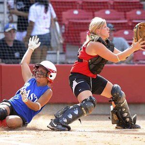 Shelby Jo Fenter (left) started the game for the East with two shutout innings Wednesday and came back to close out the game in the bottom of the seventh inning. Fenter also had two hits, including a home run, in the East’s 4-3 victory over the West.