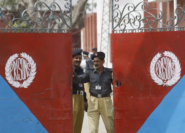 Pakistani police officers close the gate of the district jail, where five young American  Muslims from the Washington, D.C. area who were arrested in Pakistan in December, are being held in Sargodha, Pakistan, Thursday.