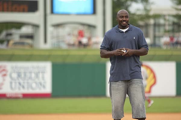 Former Arkansas Razorback Felix Jones throws out the Arkansas Travelers' ceremonial first pitch June 24 against Springfield.