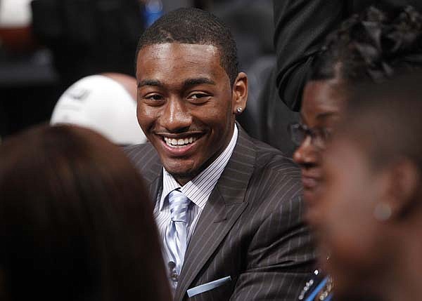 Kentucky guard John Wall, the first player chosen in the NBA Draft, waits to hear his name called by Commissioner David Stern in New York.