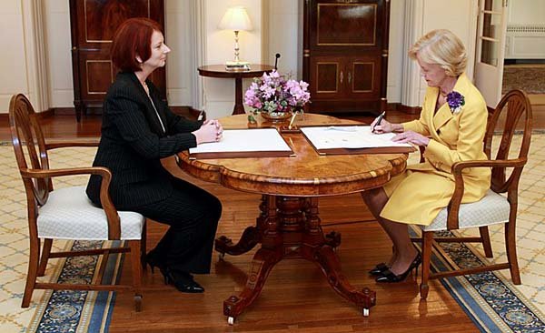 Australian Prime Minister Julia Gillard (left) watches Gov.-General Quentin Bryce during the ceremony to install Gillard in as prime minister at Government House in Canberra, Australia, on Thursday in this photo provided by Government House.