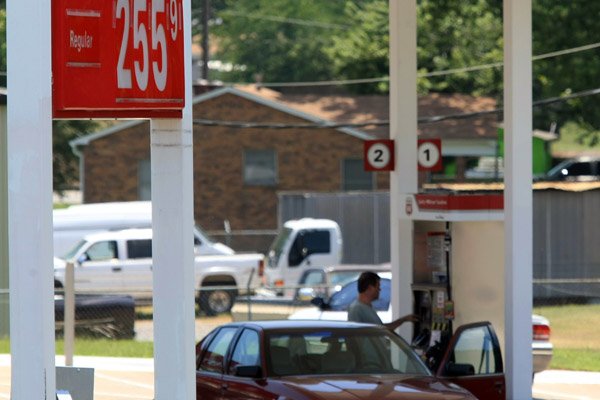 A customer gets gas Friday afternoon at the Superstop at the intersection of Military Road and MacArthur Drive in North Little Rock. Gas prices have been rising after decreasing over the last six weeks.