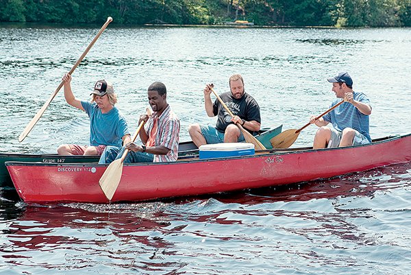 Marcus (David Spade), Kurt (Chris Rock), Eric (Kevin James) and Lenny (Adam Sandler) paddle their canoes in Grown Ups.